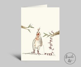 Folded Christmas card with a humorous illustration of a chicken wearing a Santa hat, surrounded by festive elements like branches and a greeting.