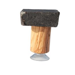 Magnetic soap holder with a plate for the soap. Made of wood and metal. Rectangular shape with a dark color.