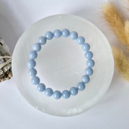 Gray round beaded bracelet made of 8mm angelite stones.