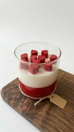  Red and cream layered candle with red cube pieces, glass container, romantic love-themed design