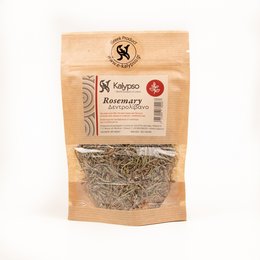 Dried rosemary herb in a paper bag, with fresh rosemary sprigs in the background. The rosemary has a green, woody appearance and a distinctive aroma.