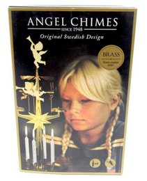 Gold-colored angel chime candle holder with multiple tiers and candle holders. Elegant and decorative design suitable for dinner table or home decor.