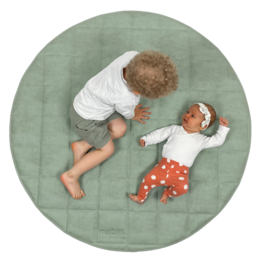 Mint green circular playmat with a soft, textured surface. Features a mother and baby lying on the mat.