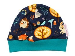 Navy blue baby hat with forest animal graphics, including foxes, owls, and mushrooms. Made of soft, stretchy material for a comfortable fit.