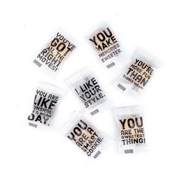 Individually wrapped shortbread cookies with inspirational quotes, 85 pieces in a box. Cookies in a variety of shapes and sizes with text such as "You are the thing" and "Like your day".