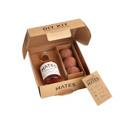 Chocolate-flavored liqueur and chocolate truffles in a gift box. Includes a bottle of liqueur and a box of chocolate truffles.