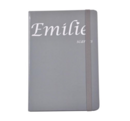  Gray notebook with the name "Emilie" printed on the cover. The notebook appears to be made of a durable material and has a simple, minimalist design.