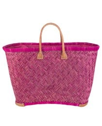 A large, vibrant pink woven straw tote bag with leather handles and trim. The bag has a classic, casual style that would be suitable for shopping, beach trips, or everyday use.