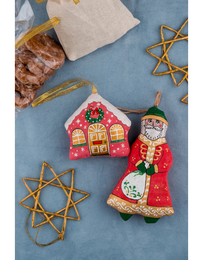 Festive textile Santa decoration with intricate embroidered patterns, vibrant colors, and a whimsical design. Ideal for holiday decor and gift-giving.