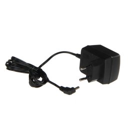 Black plastic adapter for Christmas village ornaments. Provides power to light up the village scene.
