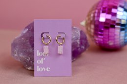  Elegant drop earrings with a simple "Lots of Love" message, featuring a gold-tone metal design with a delicate charm.