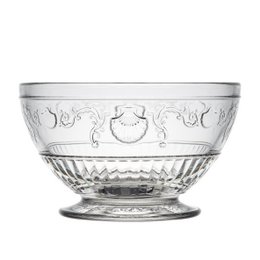 A clear glass bowl with an ornate, floral design. The bowl has a wide, shallow shape and a pedestal base.