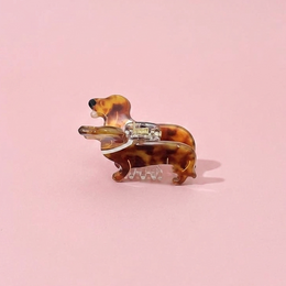  Colorful fish-shaped hair clip made of plastic, available in rose and green colors.