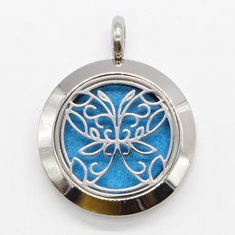Stainless steel aromatherapy necklace with abstract butterfly design and blotters for diffusing scents.