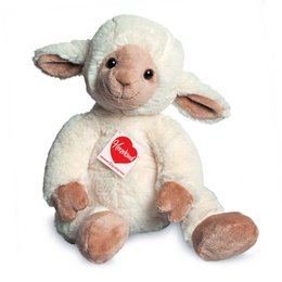 Soft, plush lamb toy with a red heart emblem, perfect for cuddling.