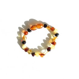 Amber baby bracelet with mix of amber, cherry, and cognac colored beads. Handmade, natural, and safe for babies.