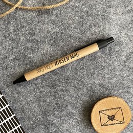 A simple black pen with the text "Pocket Brush Pen" printed on the barrel.