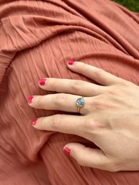 Stainless steel ring with real forget-me-not flower, available in gold and silver, featuring a delicate floral design and a vibrant color palette.