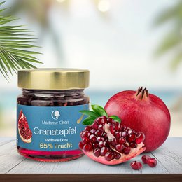 Pomegranate jam in a glass jar with a green label. The jam appears to be a deep red color and contains pomegranate seeds. The product is labeled as "Granatapfel" which means pomegranate in German.