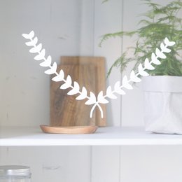 Decorative white laurel wreath window stickers in black or white color options, suitable for home decor.