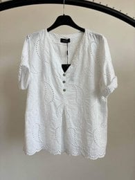 White textured short sleeve women's t-shirt with button front and v-neckline, available in multiple colors including taupe, brown, beige, green, yellow, pink.