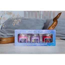  A set of 3 scented candles in a gift box, featuring a variety of fragrances. The candles are round in shape and come in a pastel color palette.