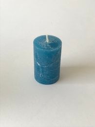 Rustic, cylindrical candle in a steel blue color, measuring 50 x 80 mm.