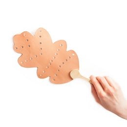 A wooden mosquito and fly flapper with a perforated design, suitable for use as a broom or swatter to control insects.