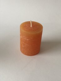 Rustic orange stumpen candle, 70mm x 90mm in size.