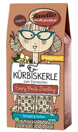 Pumpkin seeds with vanilla and cinnamon flavors, packaged in a 6-pack carton or 1 kg open container. The packaging features a whimsical illustration of a character with a pumpkin-shaped head.