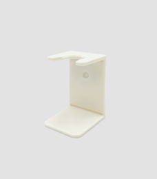 White shaving brush holder for storing and displaying shaving brushes. Made of durable plastic material.