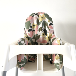 Camouflage-patterned high chair cover with soft, plush fabric for baby's comfort.
