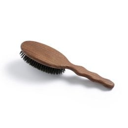 Large wooden hair brush with natural boar bristles for styling and grooming.
