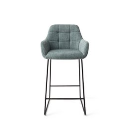  Beige upholstered bar chair with black metal frame. Arch-shaped backrest and padded seat for comfort. Suitable for use as a counter or bar stool.