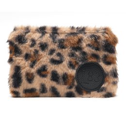 Leopard print makeup pouch with zipper closure.
