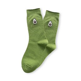  Long, lime green socks with avocado-shaped eyes printed on them. The socks appear to be made of a soft, stretchy material and are designed to fit a range of shoe sizes (36-43).