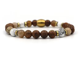  Beaded bracelet with natural stones in various shades of brown, including round beads in different sizes.