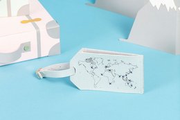 Mint-colored luggage tag with a stitched world map design, suitable for use with smartphones.