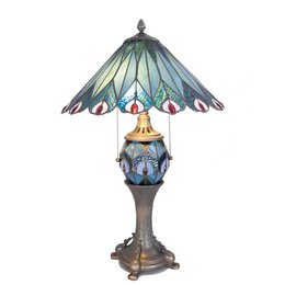 A Tiffany-style table lamp with a dome-shaped shade featuring a peacock feather design in shades of blue, green, and red. The lamp has a bronze-finished base and stands approximately 65 cm tall.