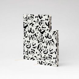 A5 and A6 sized notebook with a patterned cover featuring various panda illustrations in black and white. The notebook is made of Tyvek material.