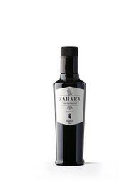 Premium extra virgin olive oil in a dark glass bottle with a black label featuring the Zahara brand name.