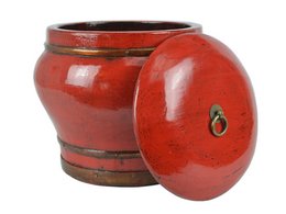 A round, tall, red ceramic decorative bucket with a lid.
