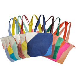  Durable, reusable shopping bag made from recycled bed linen in a variety of vibrant colors.