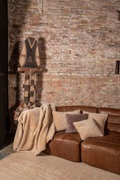Beige plaid wool throw with a cozy, rustic aesthetic. Features a soft, textured fabric and neutral color palette that complements a variety of home decor styles.