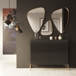 A modern, minimalist shoe cabinet with a sleek black finish and unique curved mirror design. Provides ample storage space for shoes and accessories.