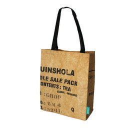  A shoulder bag made of recycled tea packaging material, featuring a simple and practical design with a black strap.