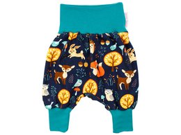 Navy blue baby pants with a forest animal print, featuring foxes, owls, and trees. The pants have a fir green waistband and are available in sizes 50/56 to 98/104.