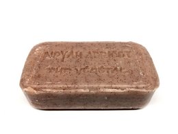 Rectangular brown soap bar with "New York Soap" and "My Facial" text imprinted on the surface. The soap appears to be scented with apricot.