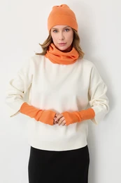  Orange knit trio set with beanie, scarf, and arm warmers. Cozy winter accessories bundle.