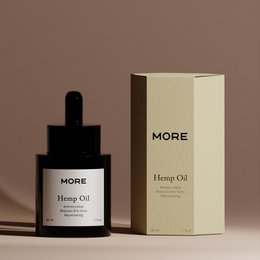 100% organic and cold-pressed hemp seed oil in a dark glass bottle with a minimalist label and packaging.